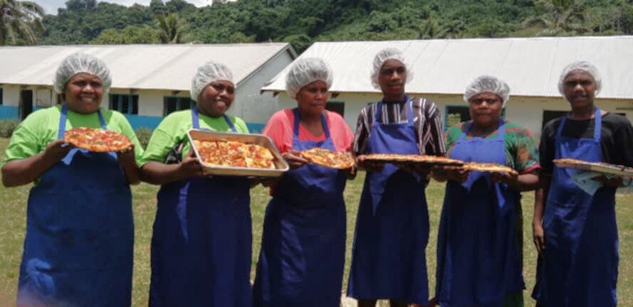 Photo 4 - Cookery participants with their homemade pizza