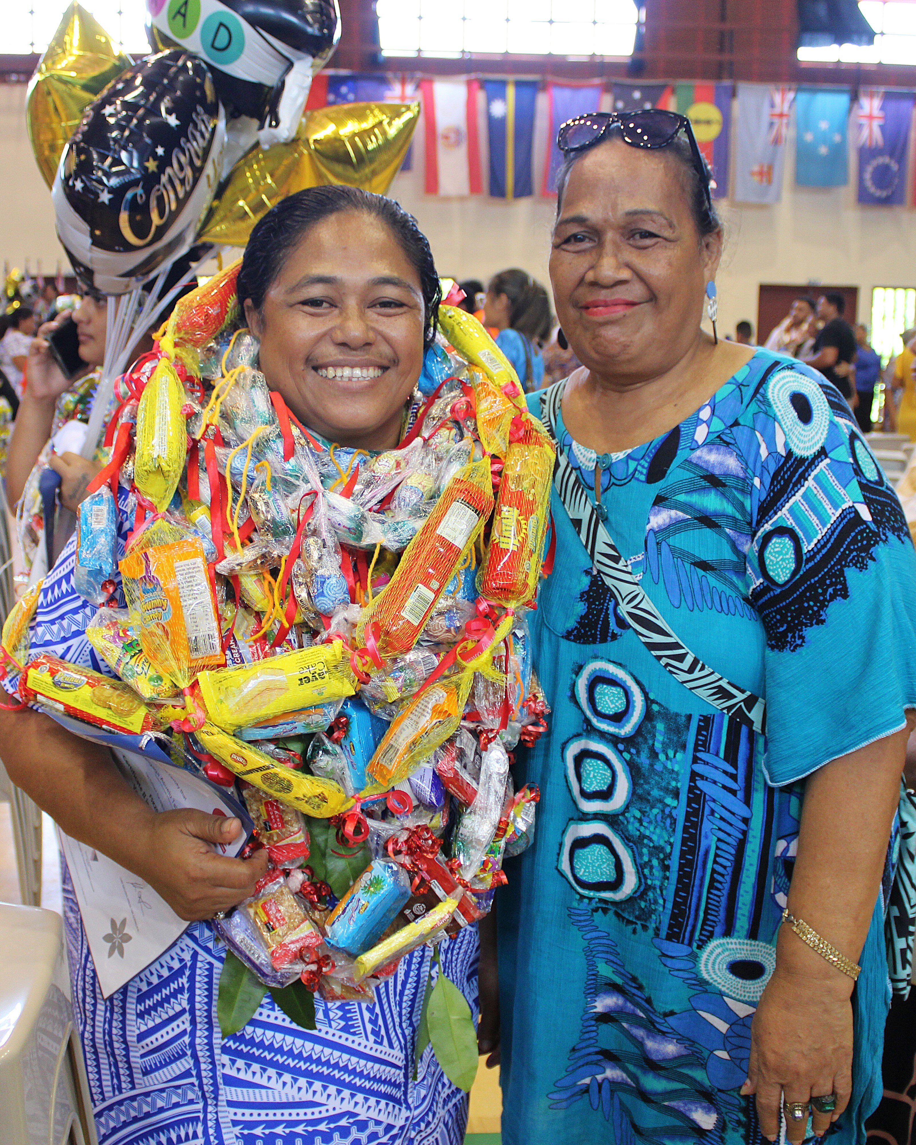 Photo 4 - Ligaga Asuelu, Certificate II in Skills for Work and Vocational Pathways graduate with a family member.