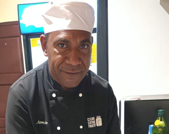 Judas Yawa, the Senior Sous Chef at Mt. Ararat Hotel in Mount Hagen, PNG, and a proud graduate of the Certificate III in Commercial Cookery from APTC shows his culinary skills.