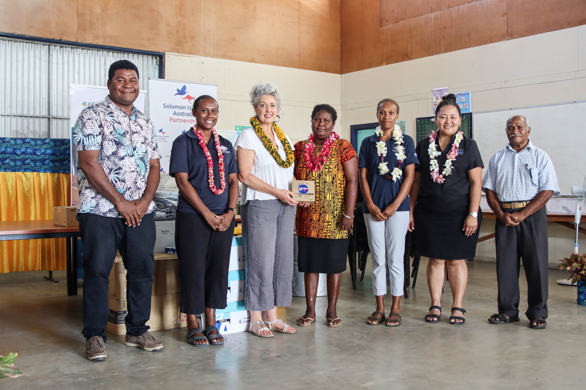 Australian High Commission representatives with Bethesda Principal, Mrs Thelma Awasi (centre), APTC Executive Director Nicki Baird (third from left) during the official handover. Australia donated ICT equipment, generator and classroom furniture to Bethesda Disability and Support Centre. 