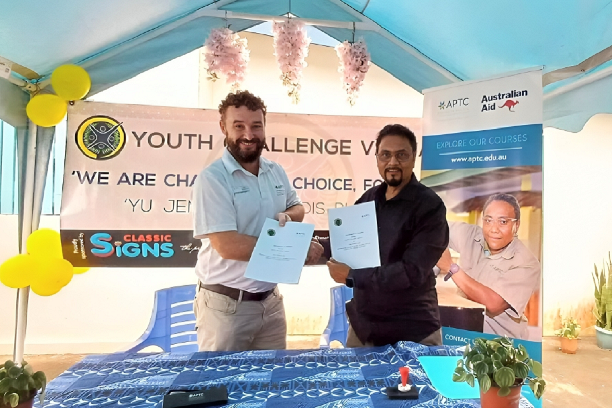APTC Country Director for Vanuatu and Nauru, Nicholas Venables, and the Chairman of Youth Challenge Vanuatu, Narand Jag Beerbul, at the MOA signing.